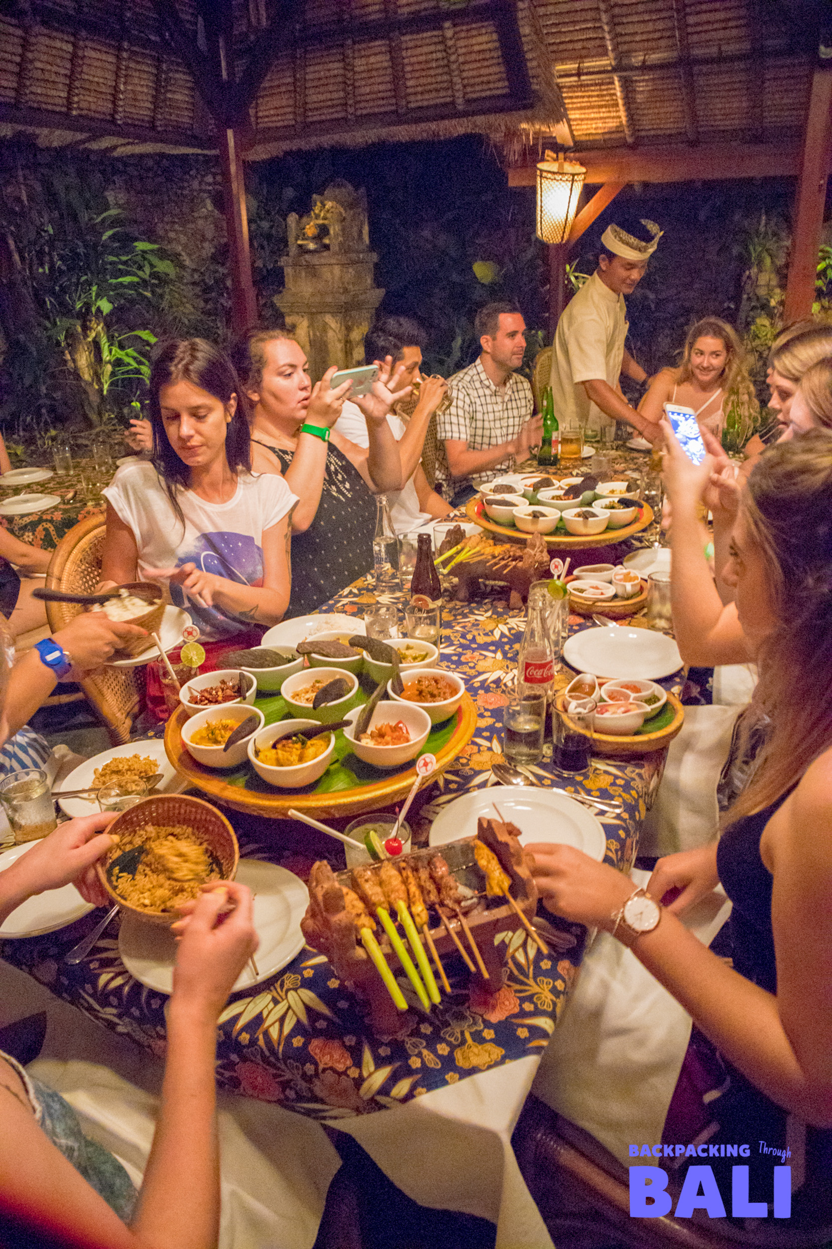 Backpacking group enjoying Balinese welcome dinner together