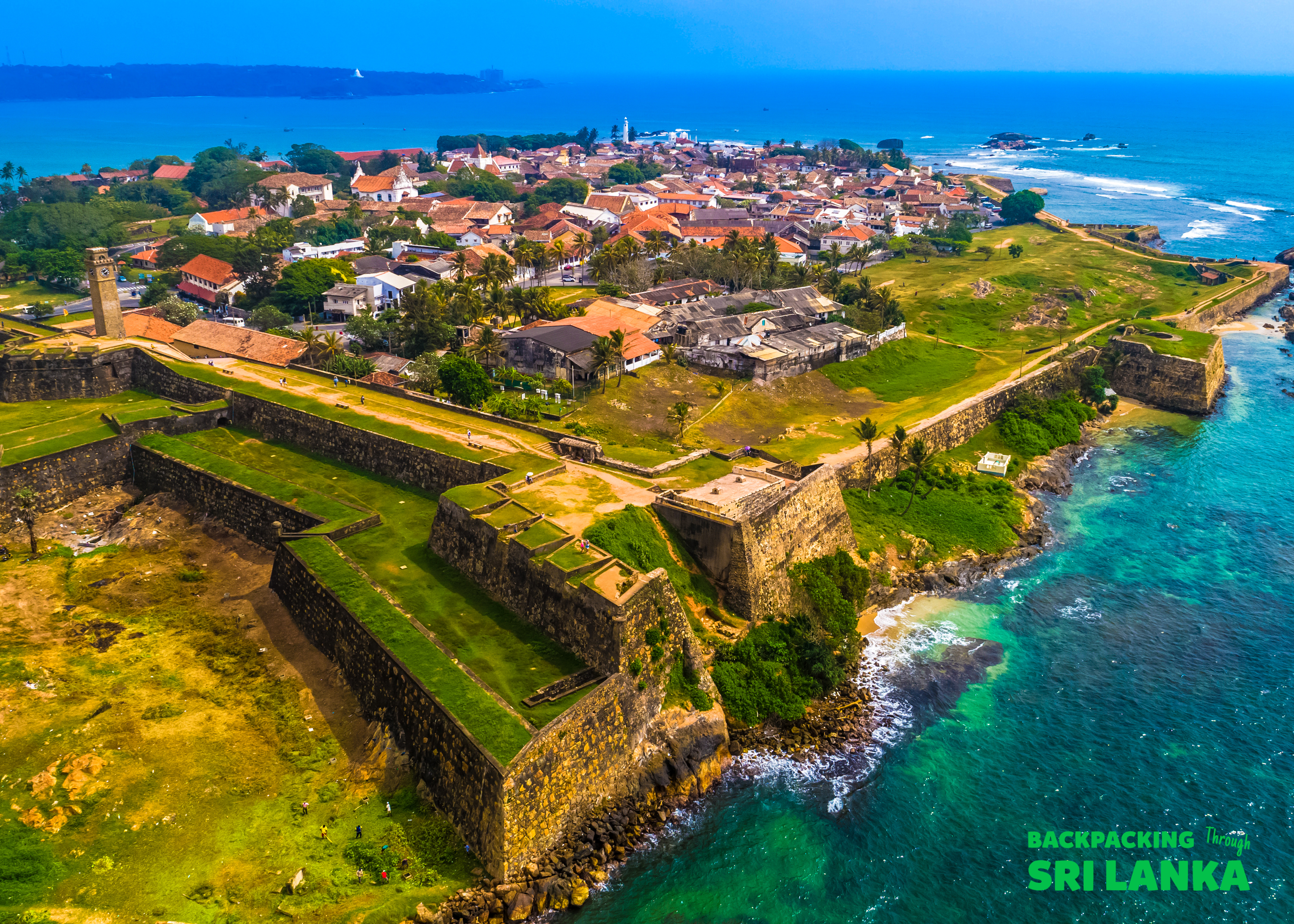 Historic Galle Fort in Sri Lanka, featuring ancient walls and buildings beside the turquoise ocean.