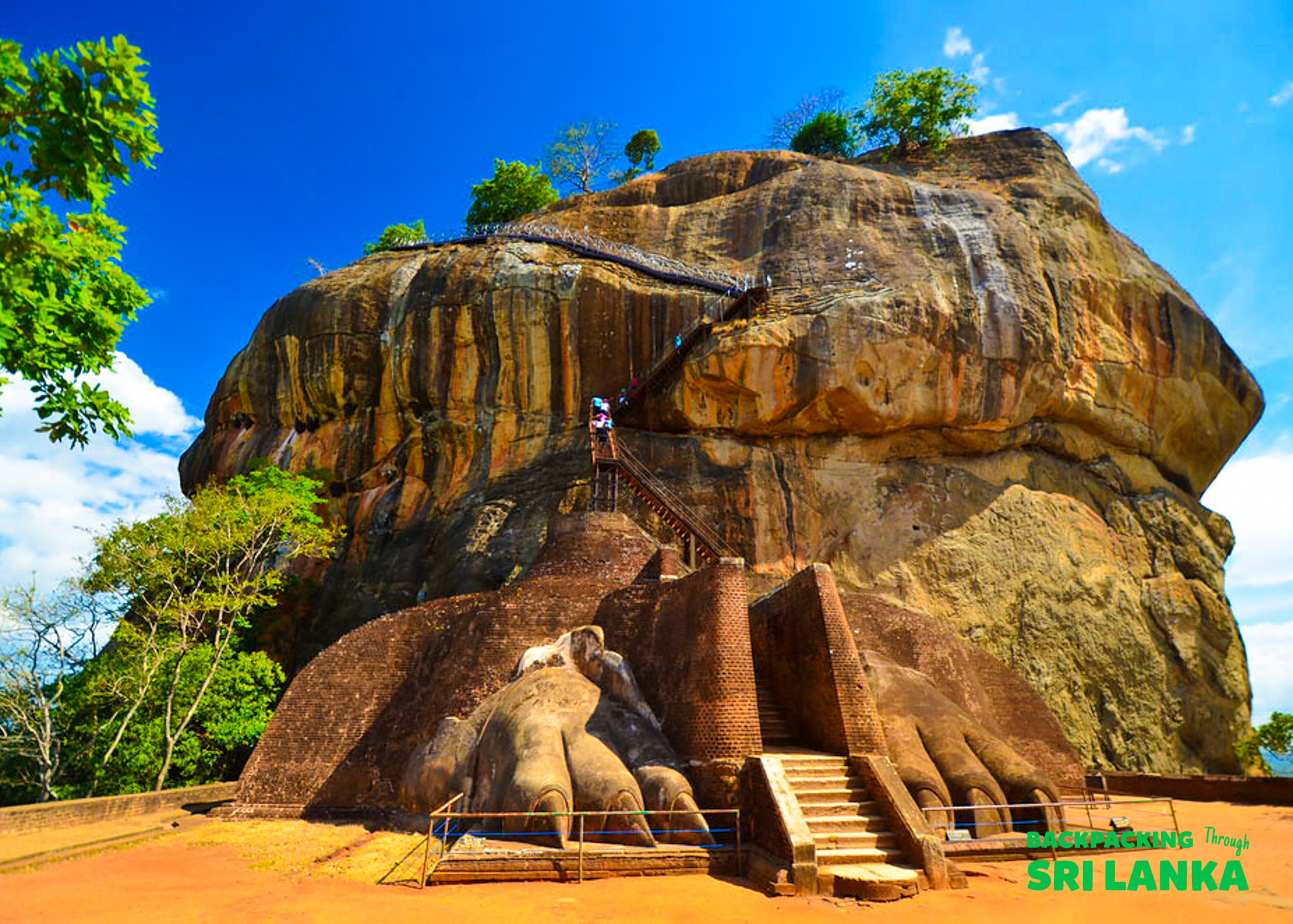 Climbers ascend the ancient stairs carved into the magnificent Sigiriya Lion Rock in Sri Lanka.