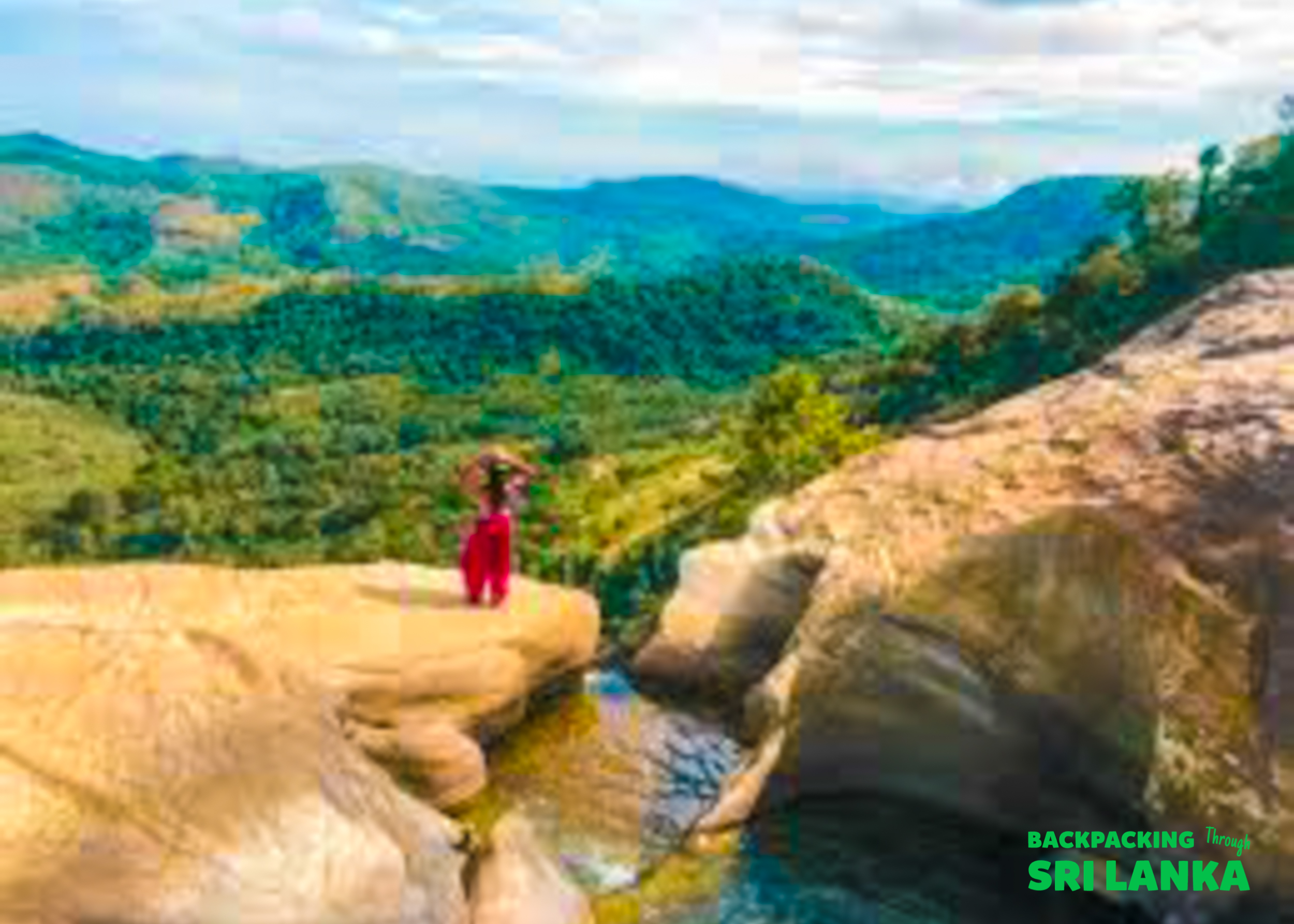 A traveler in a red dress stands on a cliff edge overlooking the stunning Diyaluma Falls valley.