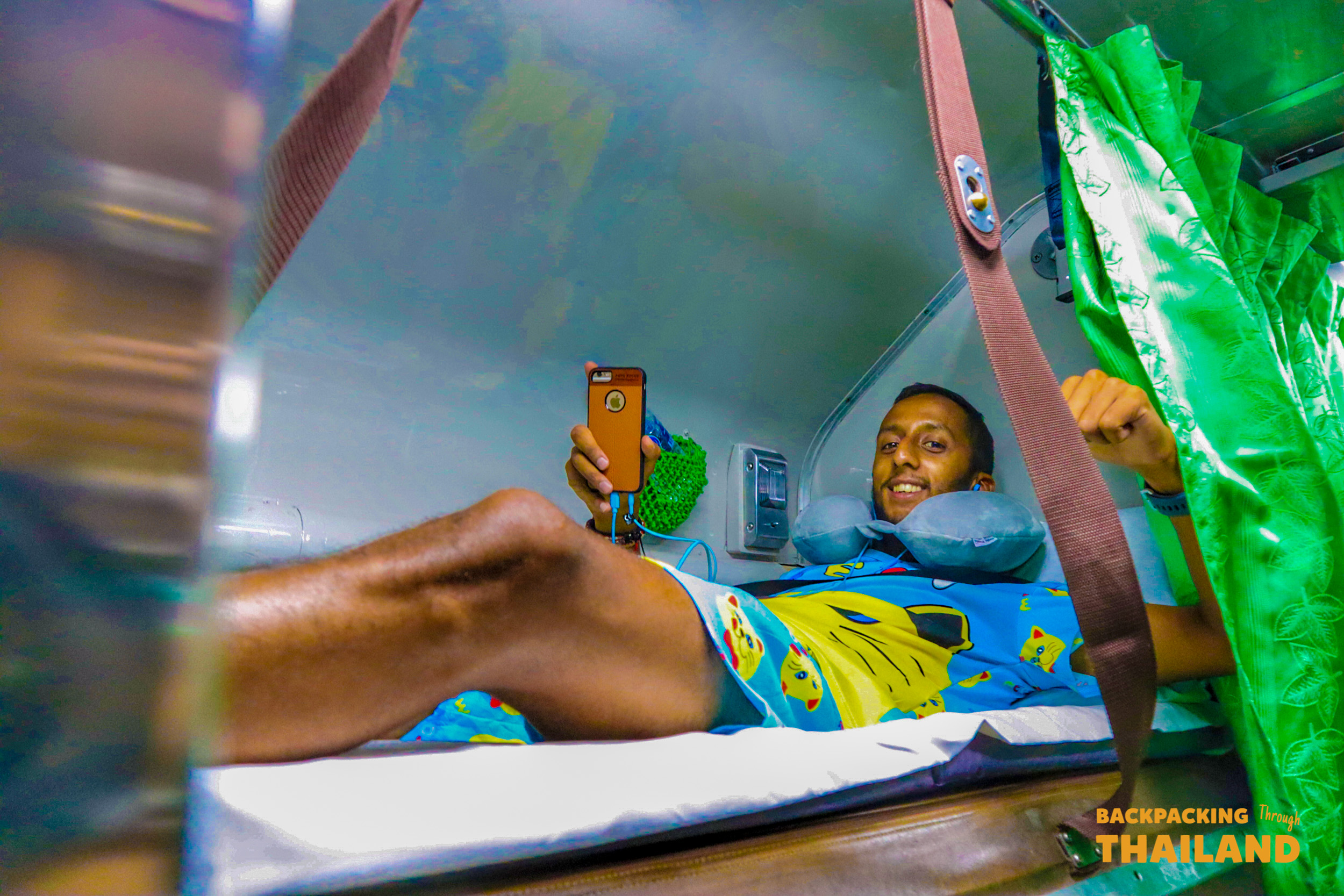 Young traveler relaxing comfortably on sleeper bed.