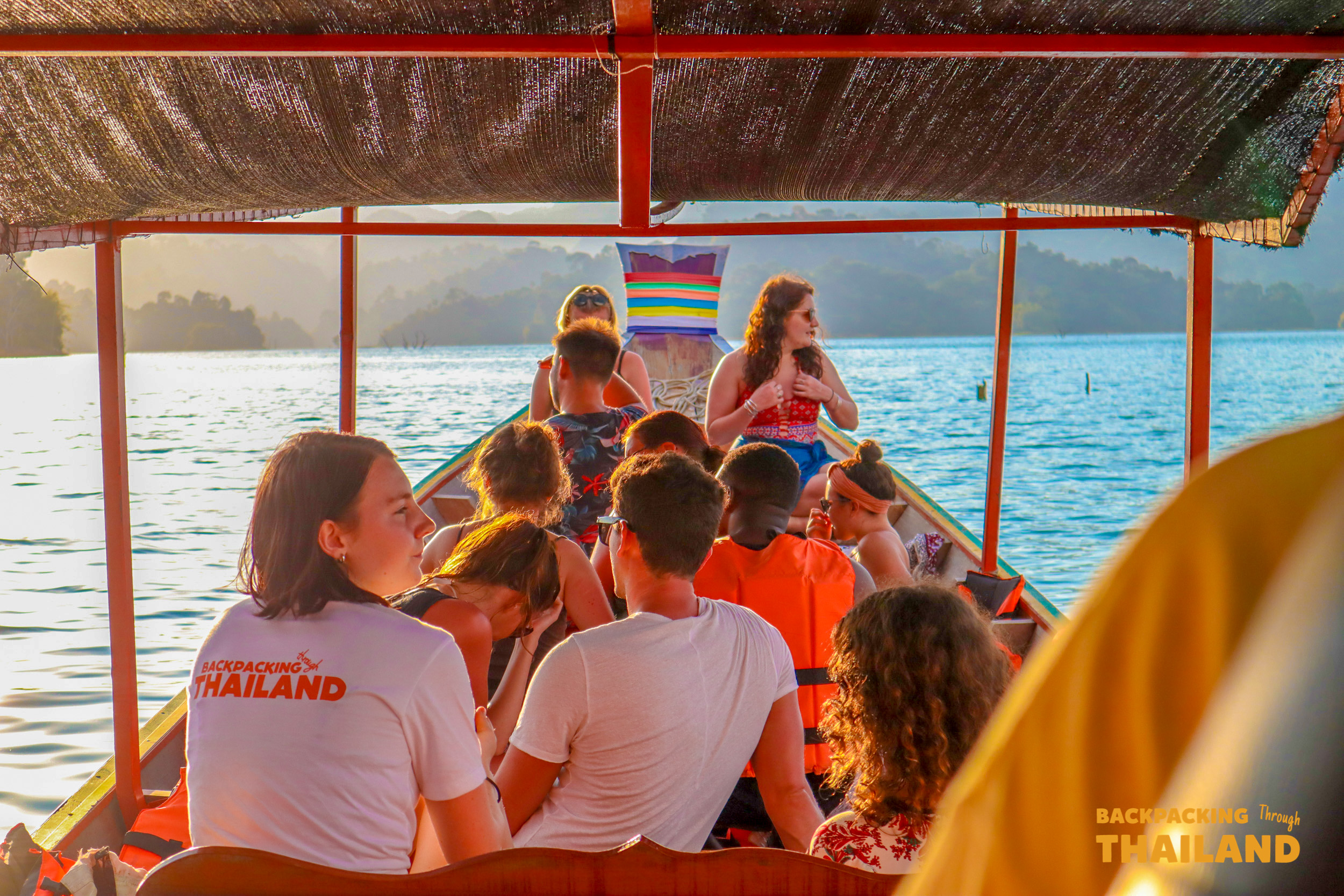 Backpacking group on longtail boat ride at Khao Sok Lake.