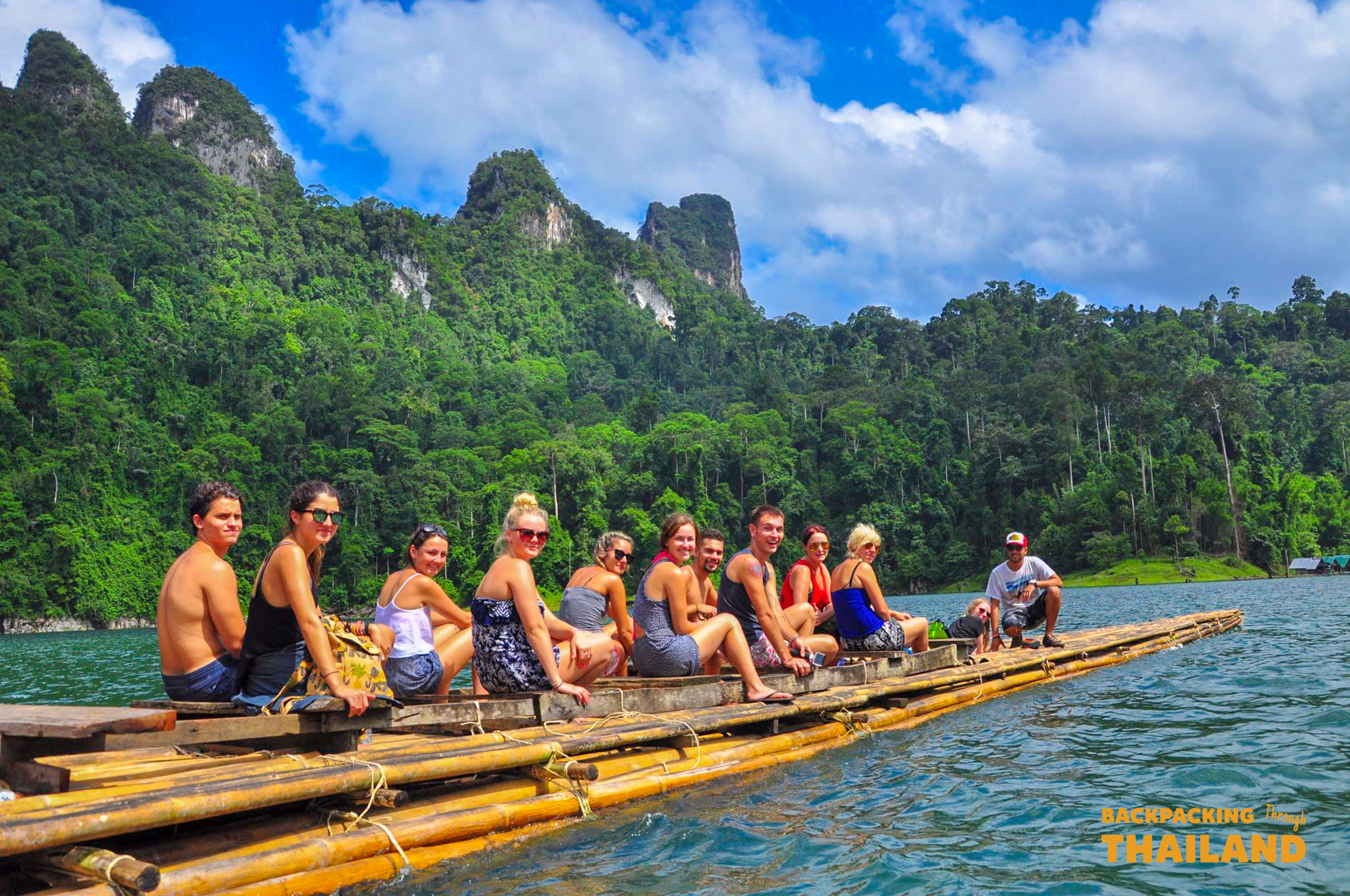 Backpacking group on bamboo raft in Khao Sok lake.