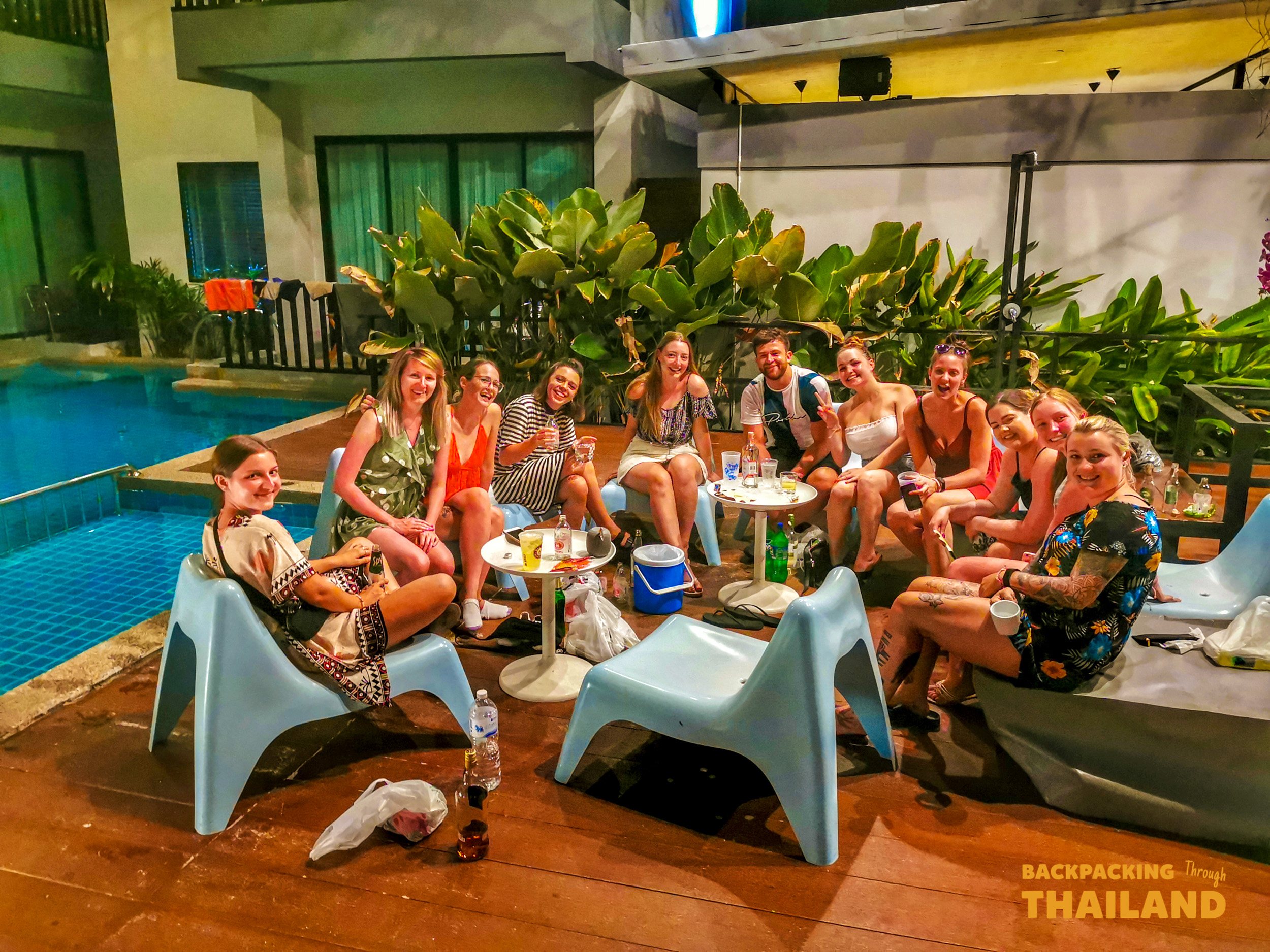 Backpacking group sitting by the pool at Ao Nang.