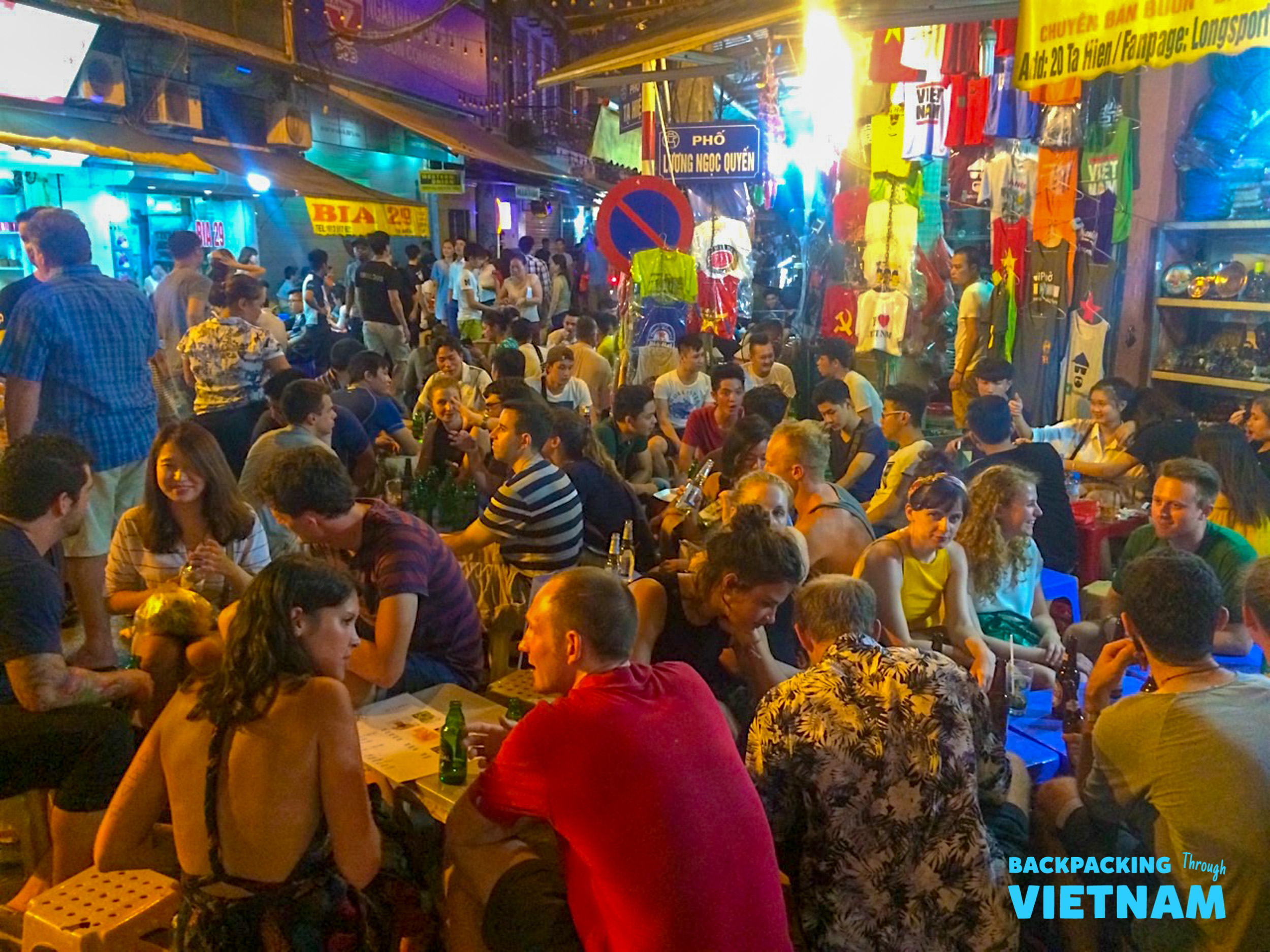 Backpacking group enjoying Vietnamese welcome dinner in Hanoi