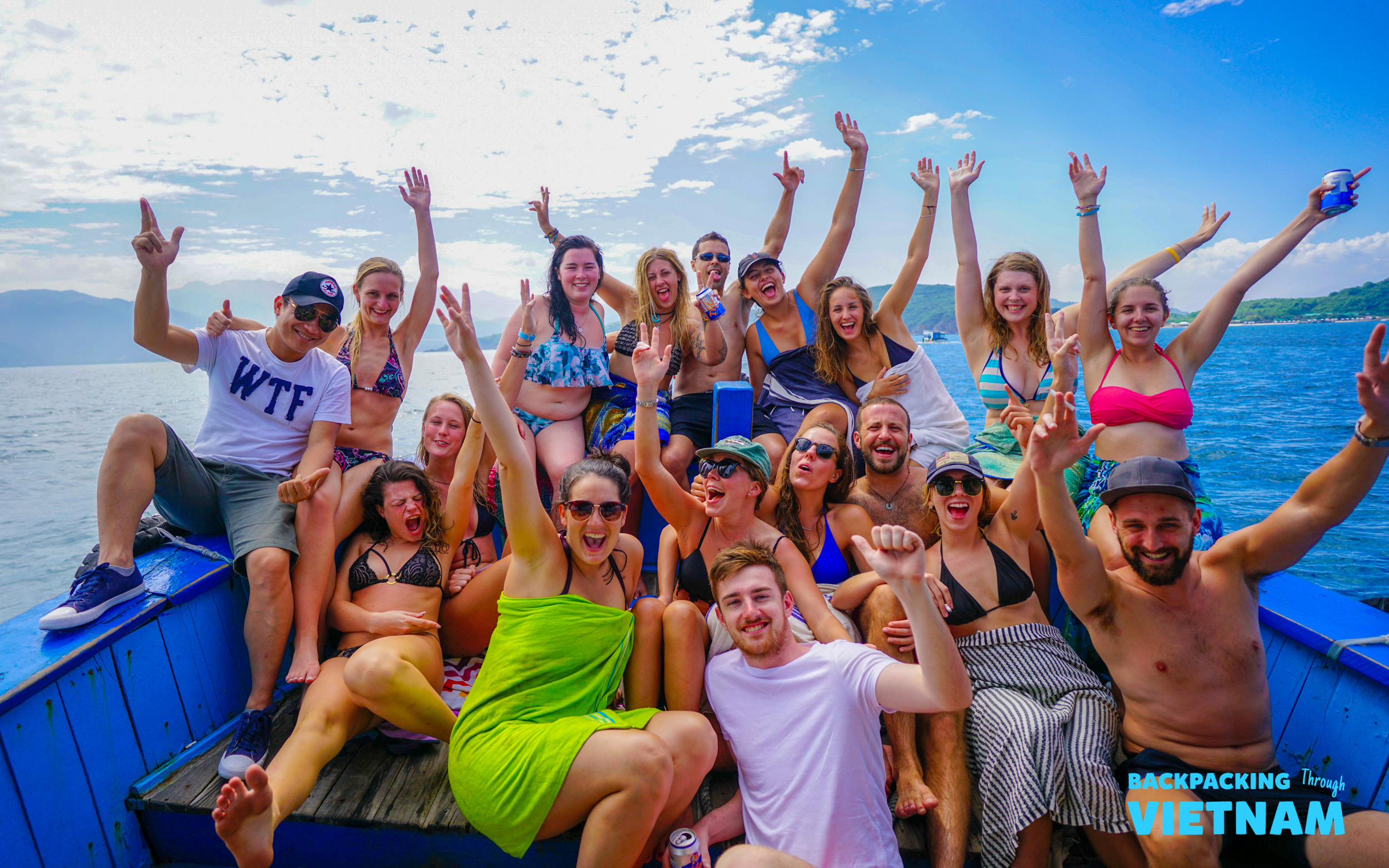 Backpacking group on boat during island hopping tour