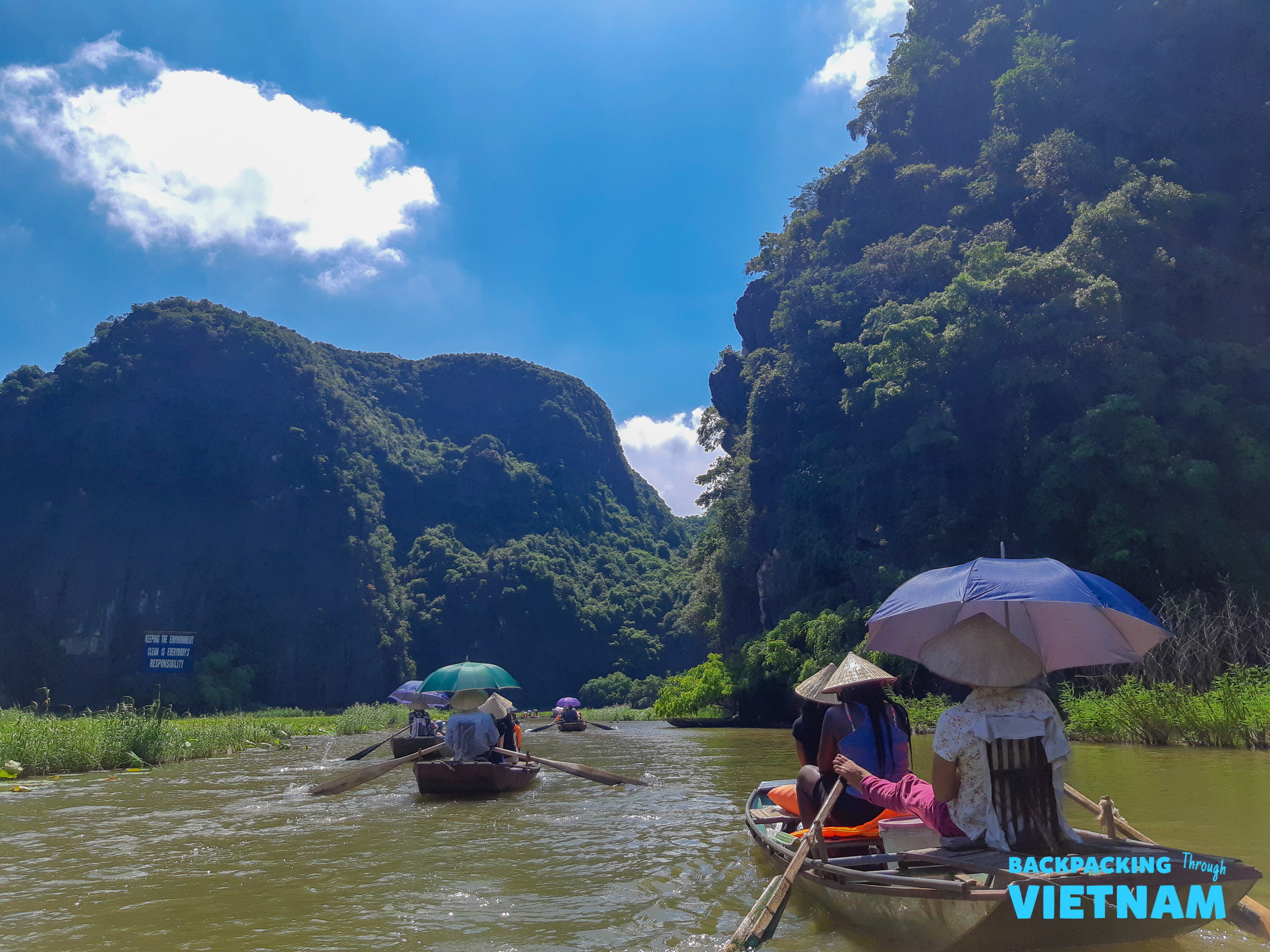 Rowing boat ride in Tam Coc through limestone mountains