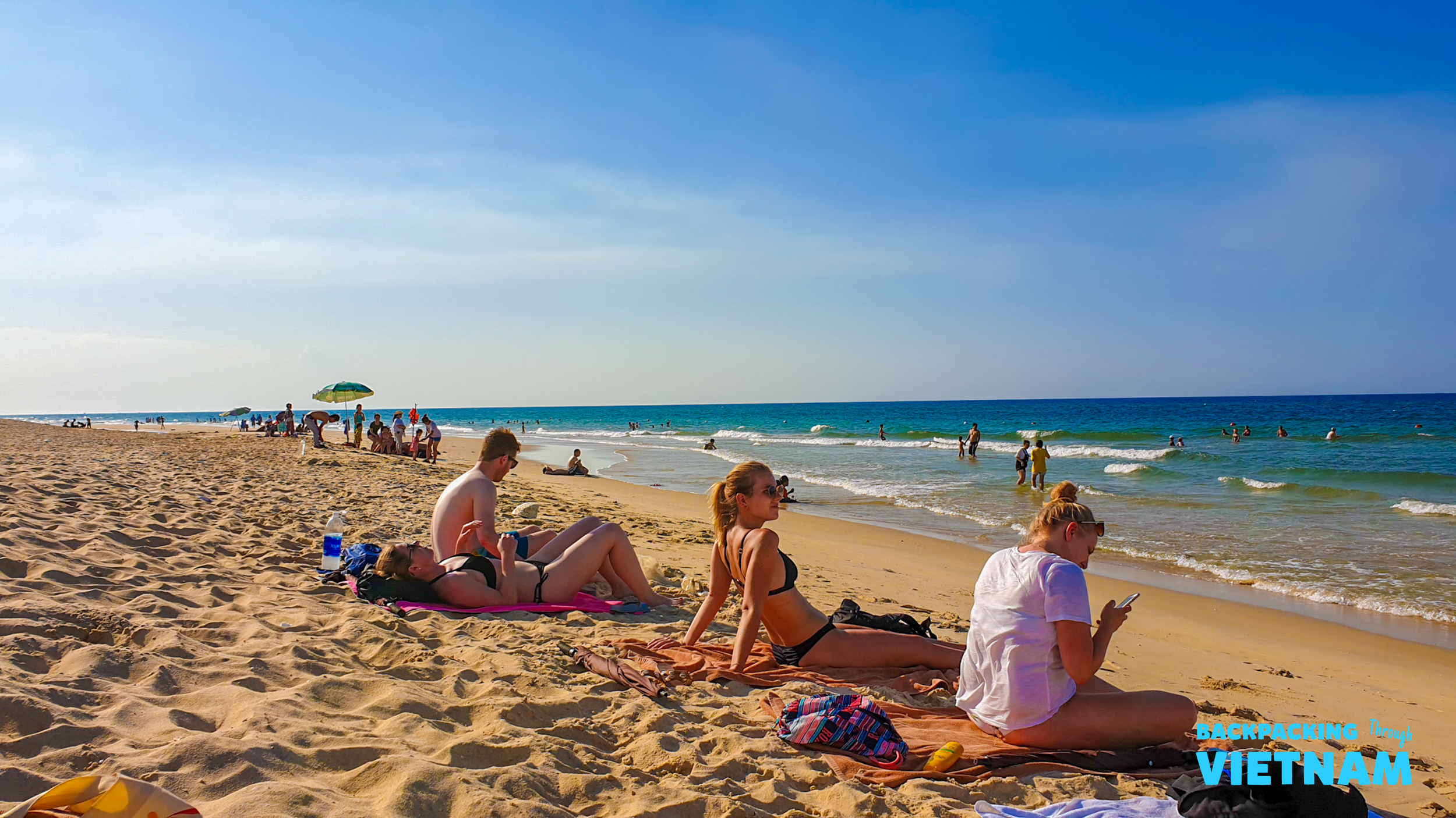 Relaxing on sandy beach en route to Hue