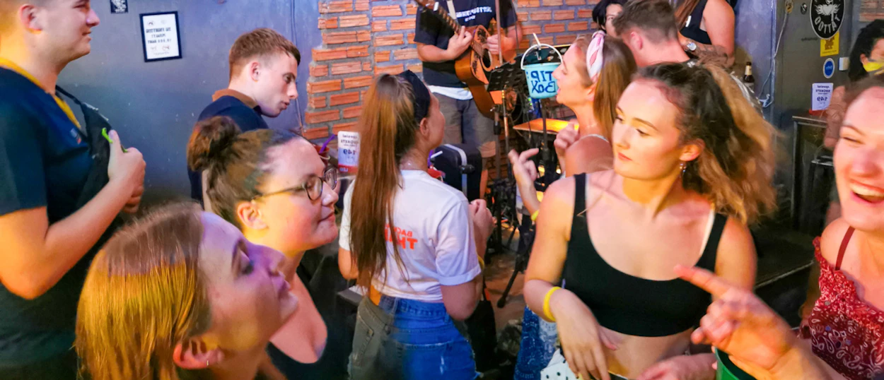 Young backpackers enjoying a lively night out with live music on Koh Phi Phi.