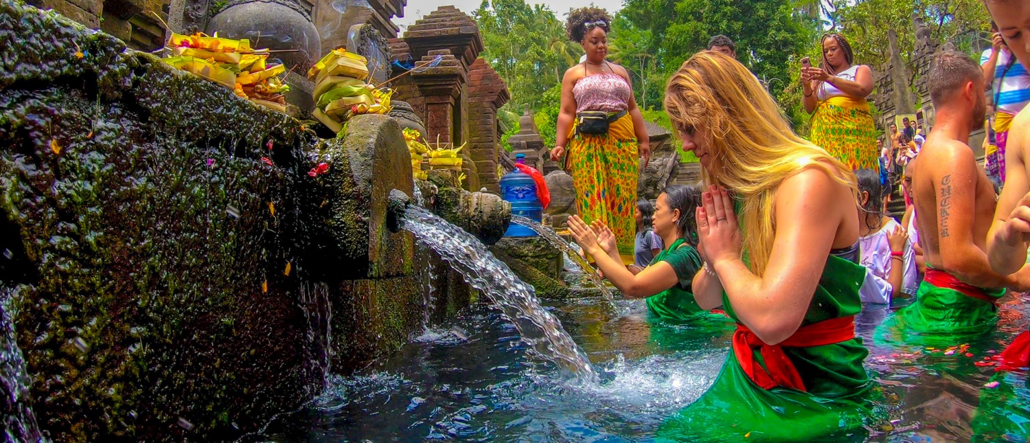 Visitors perform a spiritual water blessing ritual at Tirta Empul temple in Ubud, Bali.