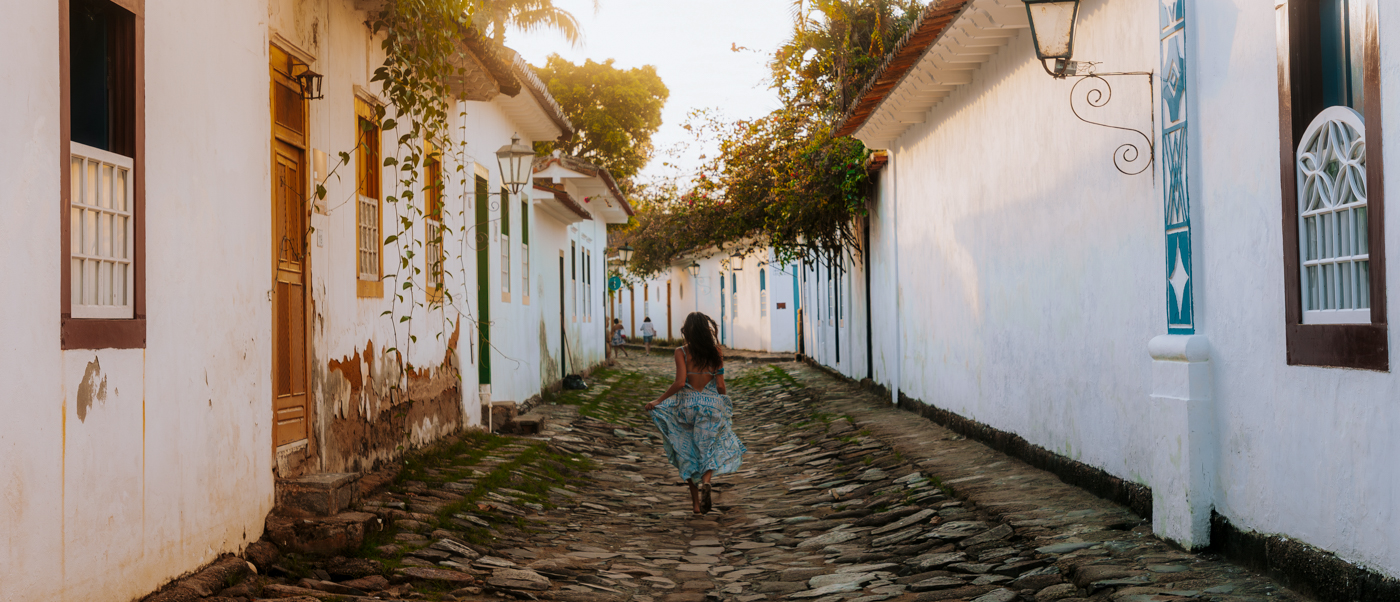 Whitewashed colonial houses along a cobbled street in Paraty