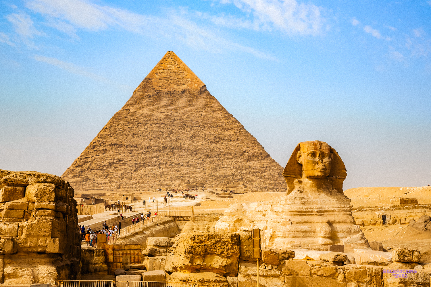 Tourists explore the ancient Great Pyramid of Giza and the legendary Sphinx in Cairo.