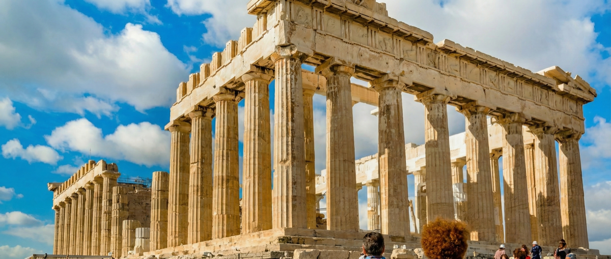 Tourists admire the majestic Parthenon in Athens, an iconic ancient Greek temple.