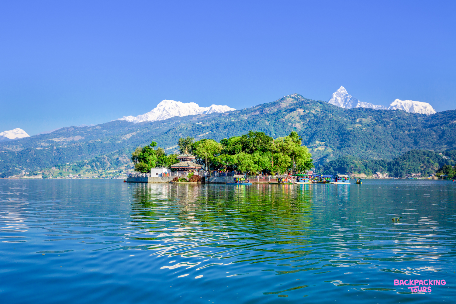 The iconic Tal Barahi Temple on Phewa Lake, Pokhara, set against the stunning Himalayan mountains.
