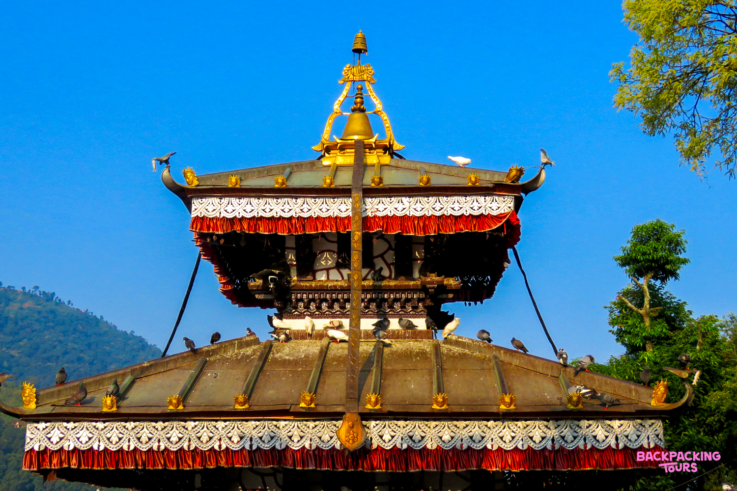The iconic Tal Barahi Temple in Pokhara, Nepal, featuring a multi-tiered pagoda roof and golden spire.