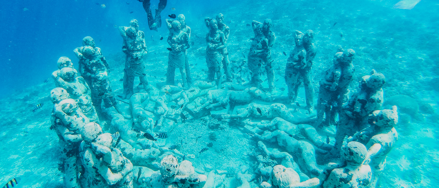 The stunning underwater Nest sculpture garden at Gili Trawangan, with a diver swimming above.