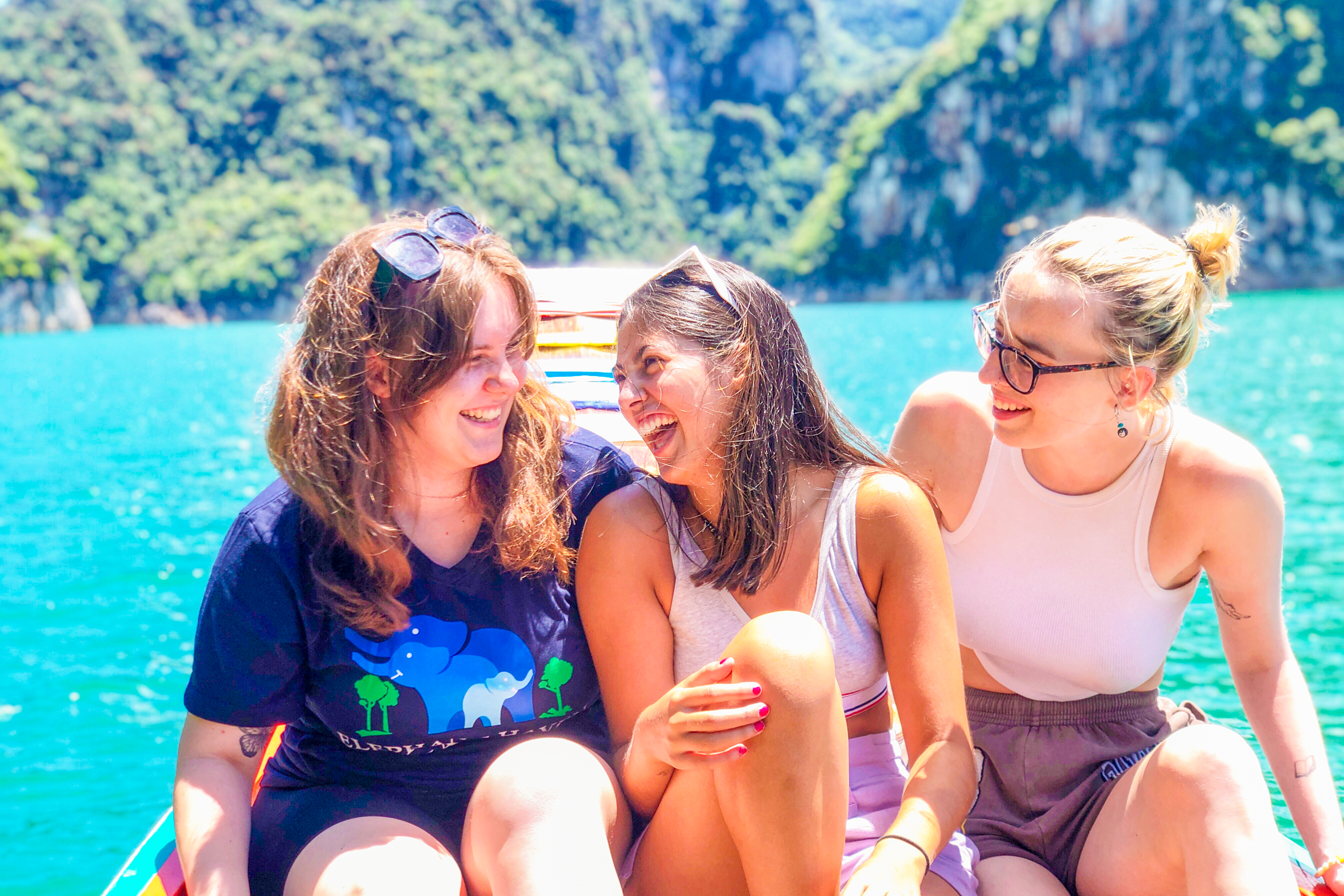 Girls travelling on a long tail boat in Khao Sok National Park, Thailand