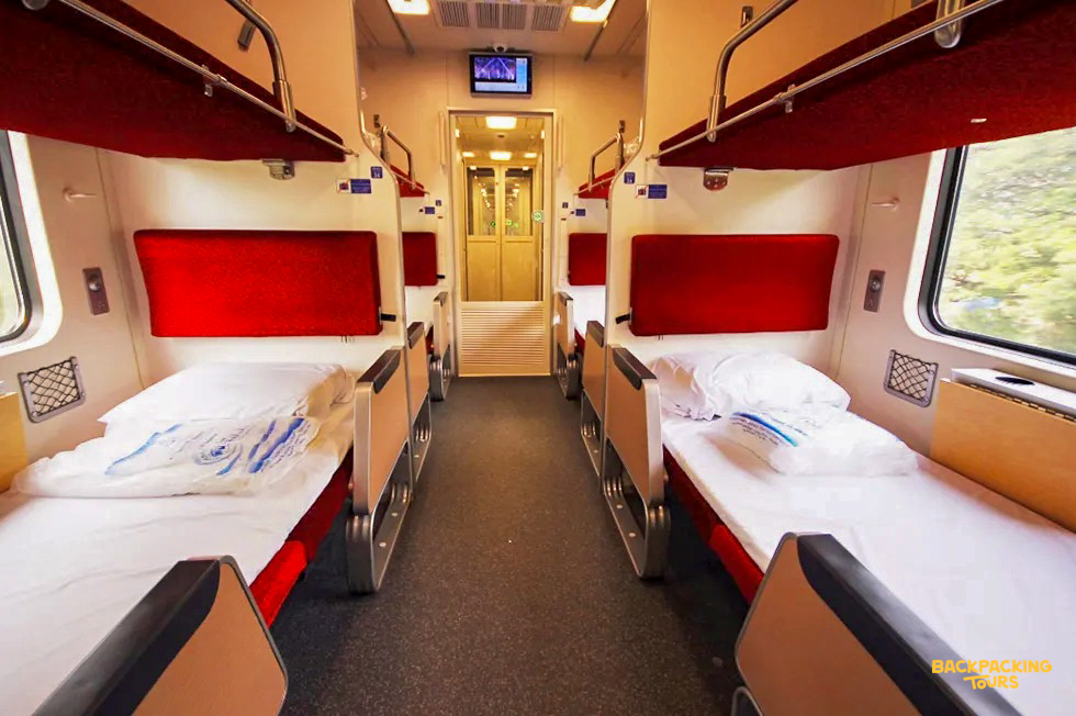 Comfortable bunk beds in an overnight train carriage, ready for a journey through Thailand's countryside.