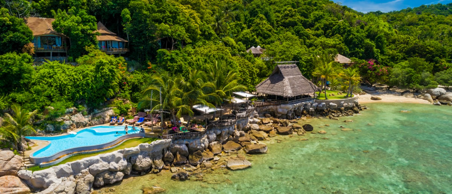 Beautiful resort with a unique pool, sandy beach, and clear waters on Koh Tao.