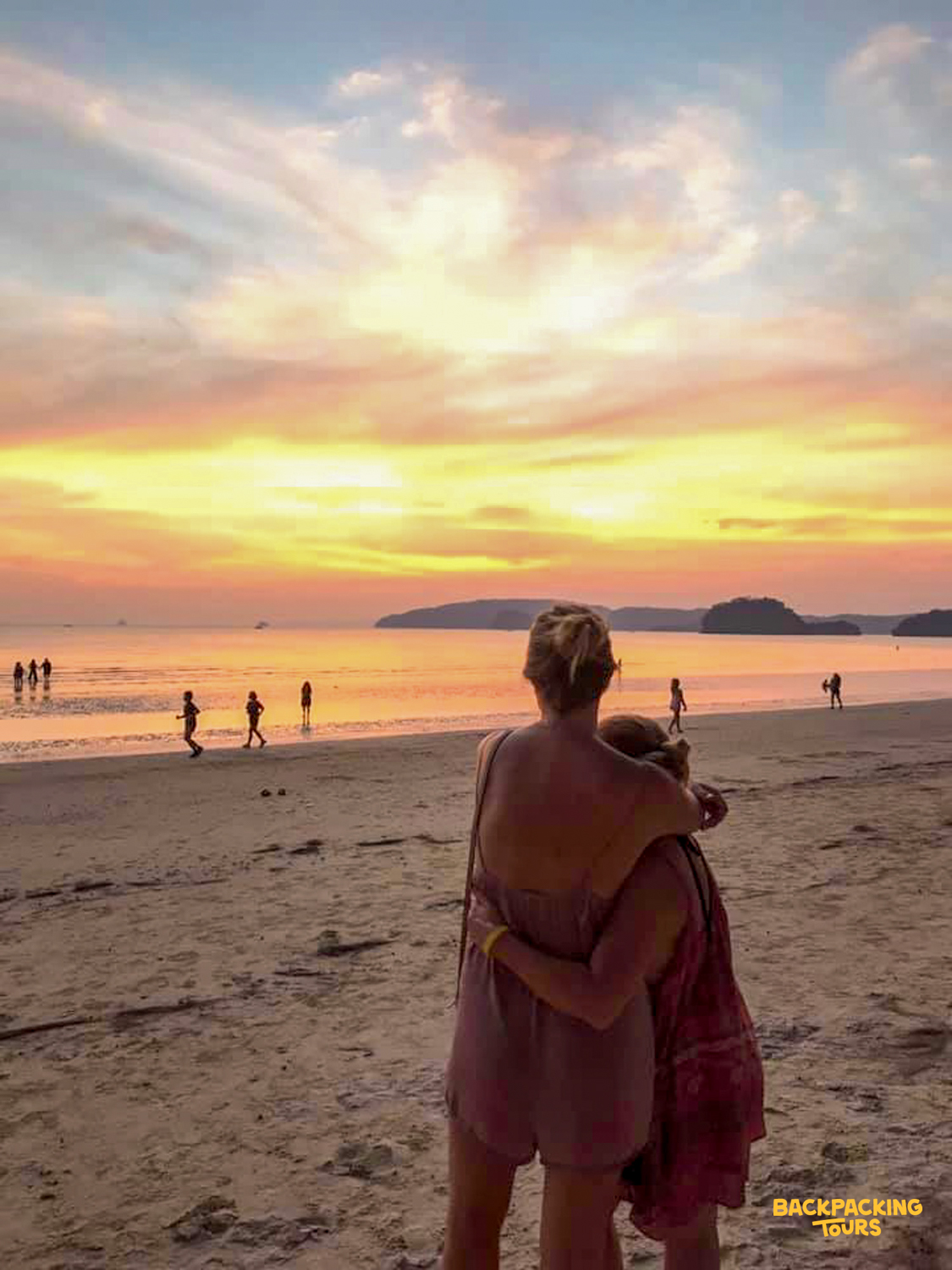 Enjoying a stunning sunset on the beach with friends in the beautiful Phi Phi Islands, Thailand.