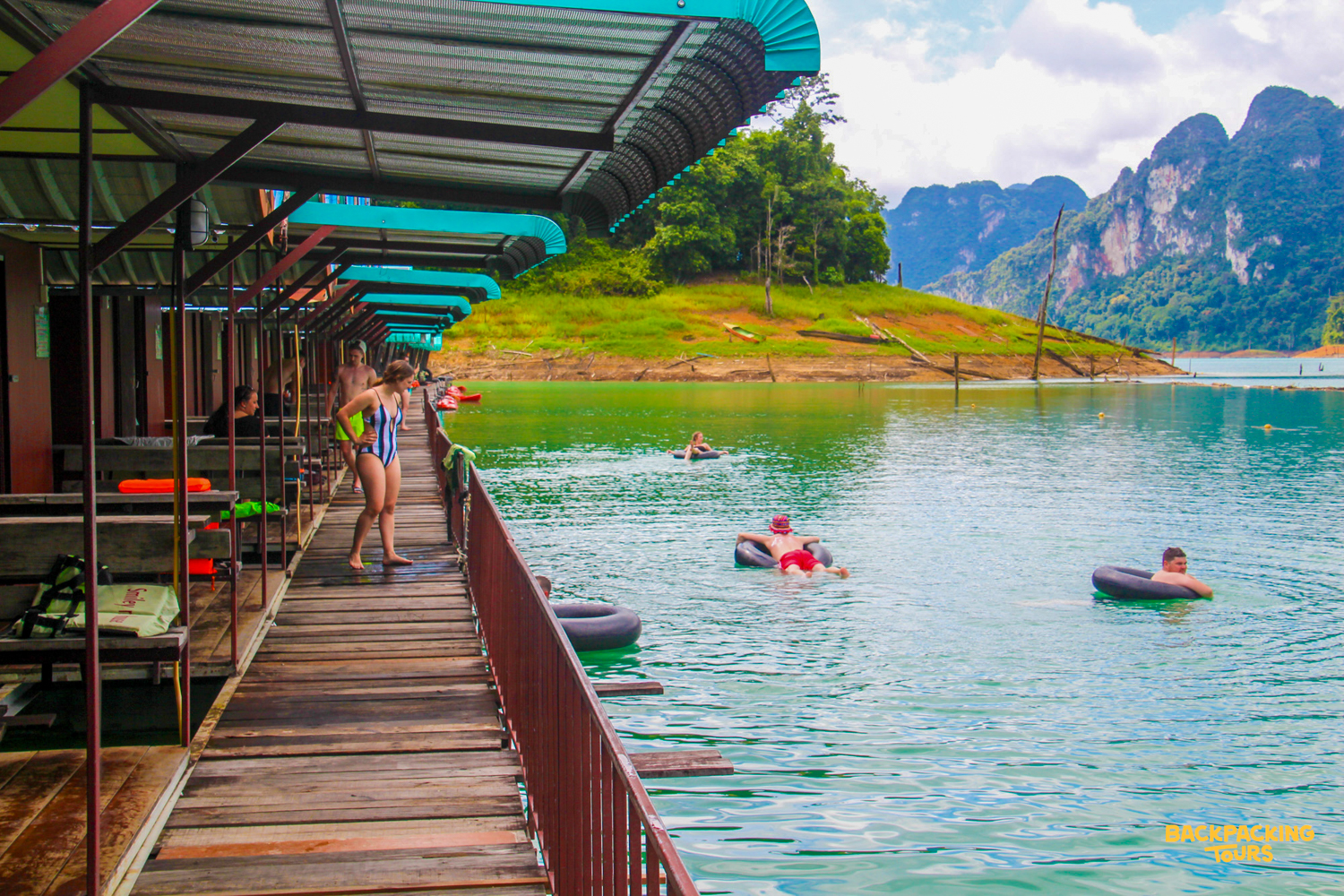 Guests enjoy floating bungalows and swimming in the emerald waters of Khao Sok National Park.